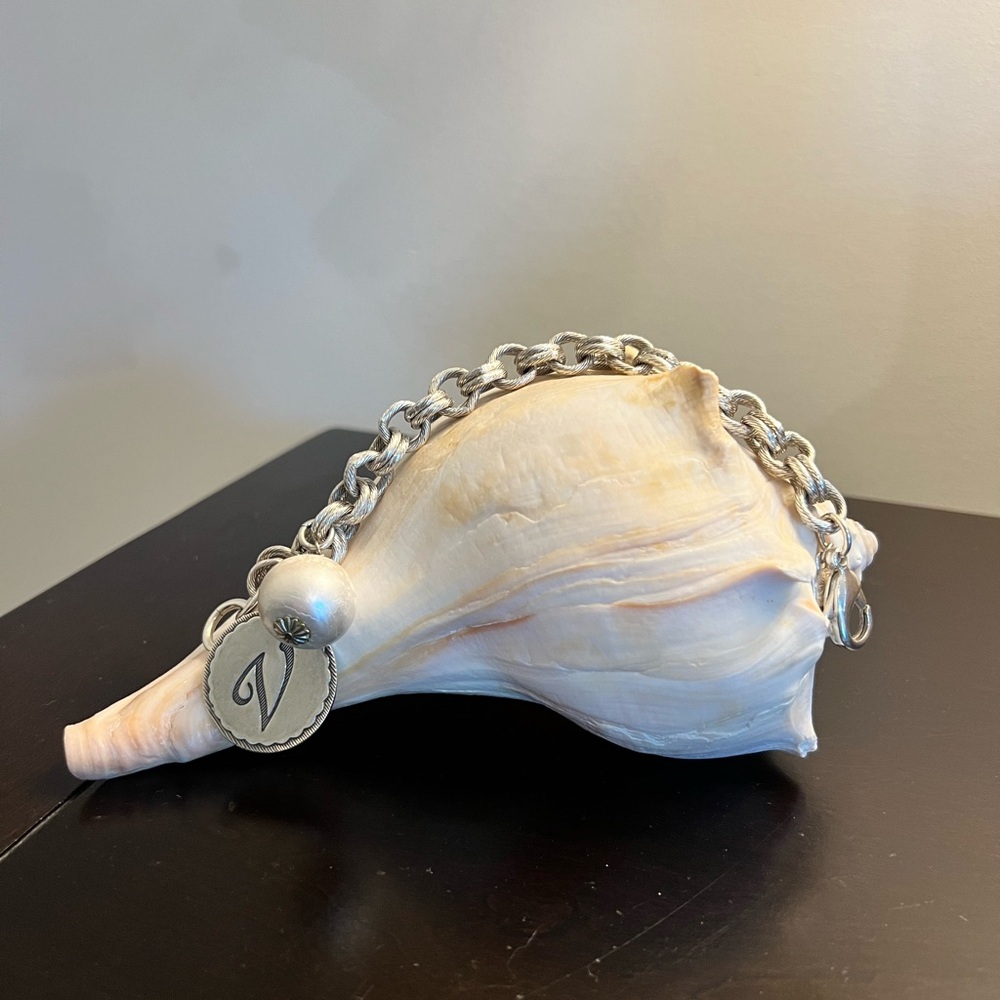 John Wind “V” charm pearl chain bracelet.